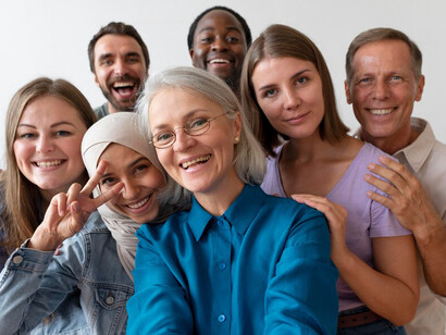 A diverse group of individuals joyfully taking a selfie together, showcasing the beauty of cultural diversity in our globalized world