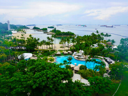 Sentosa, Singapore is a tropical retreat nestled amidst lush palm groves