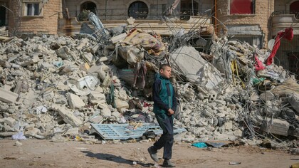 A child walking through urban ruins 