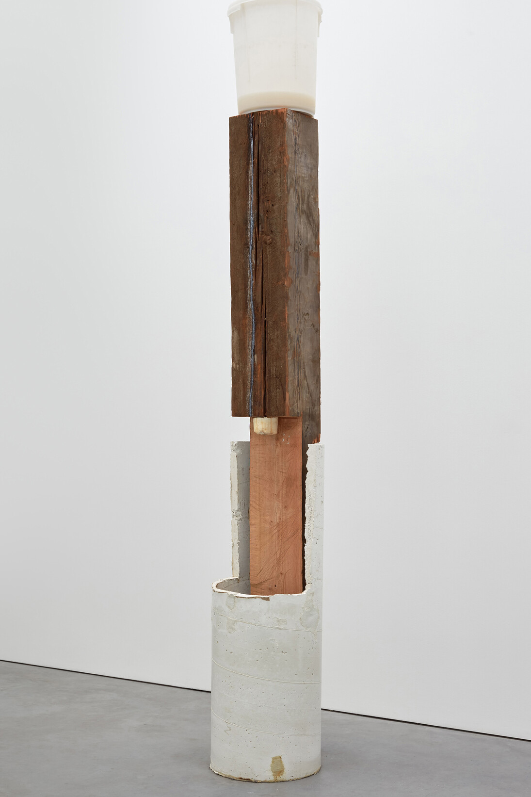 Oscar Tuazon for Ariana Reines, Pa, 2016 Concrete, wood, bucket, water, soap, paper, poems 280 x 41 x 41 cm, 110 1/4 x 16 1/8 x 16 1/8 ins. Courtesy Stuart Shave/Modern Art, London
