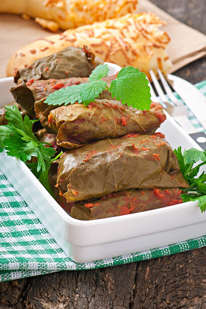 Experience the essence of Turkish cuisine with yaprak sarma, delicious grape leaves wrapped around a seasoned rice filling, offering a classic taste of Turkey's culinary traditions