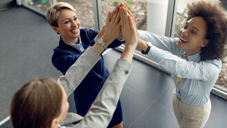 A group of employees sharing a happy moment during work hours