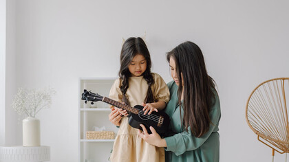 In the gentle embrace of mentorship, a young soul finds solace and strength, as the mentor shapes her thoughts with care