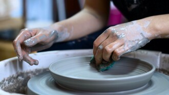 Craftsman making pottery