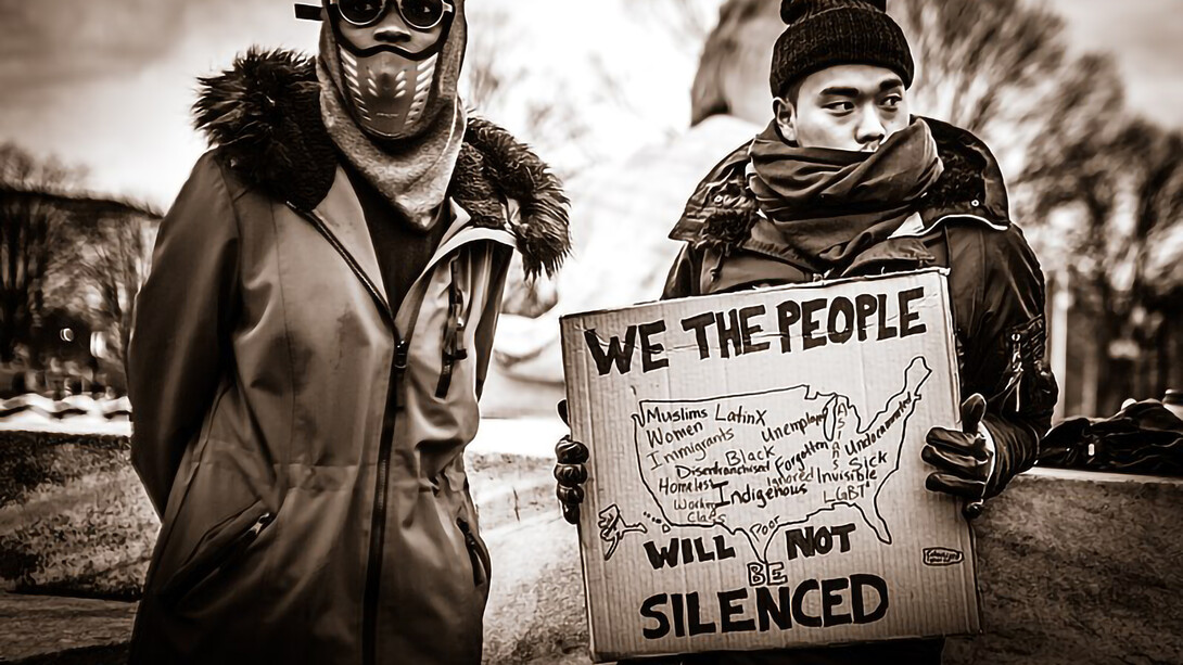 Protesters rallying against prejudice at the inauguration, standing in defiance of xenophobia and calling for inclusion and equality