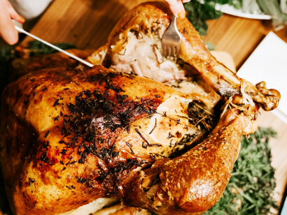 A festive Christmas family dinner, complete with a golden roasted chicken, bringing warmth and tradition to the celebration