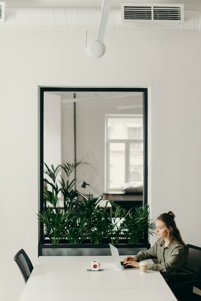 Woman sitting at a desk working on her laptop