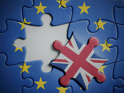 Puzzle pieces featuring the flags of the United Kingdom and the European Union, symbolizing the UK's departure from the EU and the fragmented relationship post-Brexit