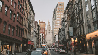 The vibrant streets of New York City, United States, come alive with the hustle and bustle of people and taxis, embodying the city's dynamic energy and allure