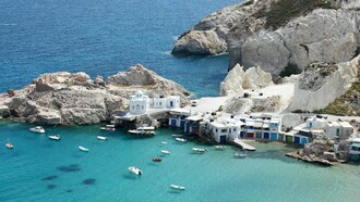 A bird's eye view of the Milos Island in the Aegean sea, symbolizing the transformation of Milos into an increasingly sophisticated island escape