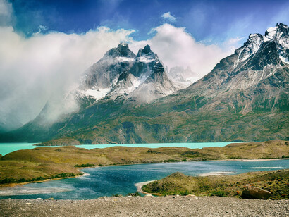 A captivating brown and blue abstract painting inspired by nature, alongside the breathtaking glacial lakes of Torres del Paine National Park, Chile