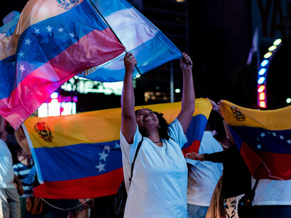 Buenos Aires, Argentina joyful Venezuelans celebrating with flags in the streets of Buenos Aires