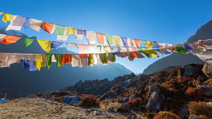 Amidst the awe-inspiring backdrop of the Khumbu region of the Himalayas, in northeastern Nepal on the Nepalese side of Mount Everest, prayer flags flutter serenely, carrying hopes and blessings across the thin, invigorating air