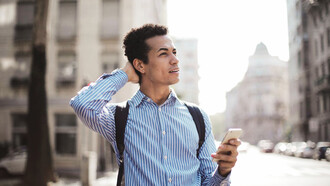 As smartphones redefine brain training, a man captivated by his device exemplifies the modern approach to sharpening cognitive skills