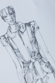 Estilista desenha croqui e cola cores para as peças de roupa