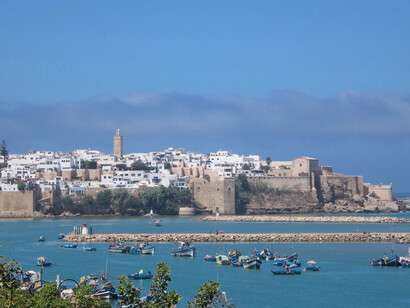 A panoramic view of Rabat’s historic waterfront, fishing boats, and coastline in Rabat, Morocco, symbolising the maritime gateway through which regional connections happen