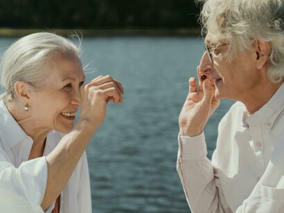 Smiling senior couple enjoying a peaceful moment by the lake