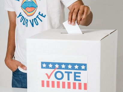 A person casting their vote