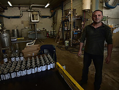 Steal not the fruits of others' labour - Dimitris Koumatsioulis at BioMe worker-run factory, Thessoliniki, Greece © Ashish Kothari