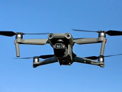 A DJI Mavic Air 2 drone captured mid-flight
