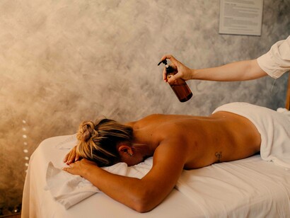 A woman getting ready to heal as she waits for the masseuse to massage out the pain