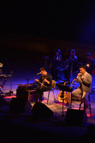 Matthaios and Konstantinos Tsahouridis along with Mimis Plessas, performing in an open theatre in northern Greece