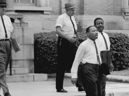 Dr. Martin Luther King, Jr. and Reverend Ralph Abernathy are escorted back to jail in Albany, Georgia, 1962. Gelatin silver print, 11 x 14 inches. © Danny Lyon, New York & Magnum Photos, New York / Courtesy Edwynn Houk Gallery, New York.