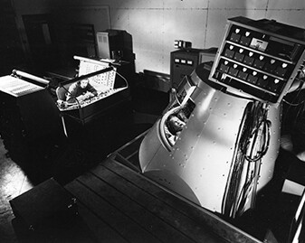 John H. Glenn, one of the Mercury Seven Astronauts, runs through a training exercise in the Mercury Procedures Trainer at the Space Task Group at Langley Field in 1960.
Courtesy NASA Langley Research Center