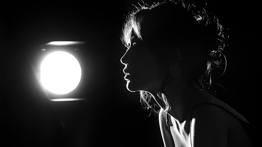 Looking out into the distance, she contemplates the deeper dimensions of pleasure that extend beyond physical sensations and touch