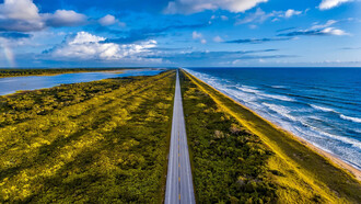 A road through Florida, with the ocean to one side and a body of water on the other