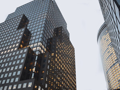 Rising majestically, a cluster of high-rise buildings dominates the cityscape, embodying the epitome of modern architectural prowess and urban vitality