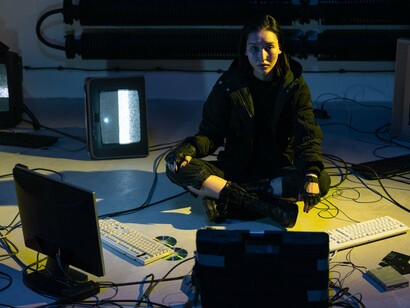 A technology expert working in a digital workspace, reflecting the increasing reliance on artificial intelligence in cyber operations