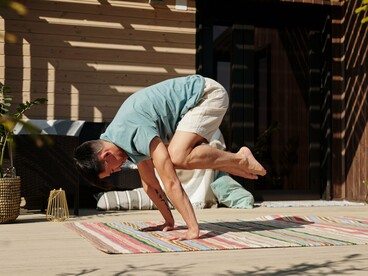 A balanced yoga pose performed in natural light, symbolizing the discipline that strengthens both body and mind