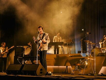 Frontman Alex Turner of the Arctic Monkeys performing live in a UK concert