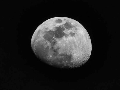 Moon phases against a dark background, depicting lunar energy