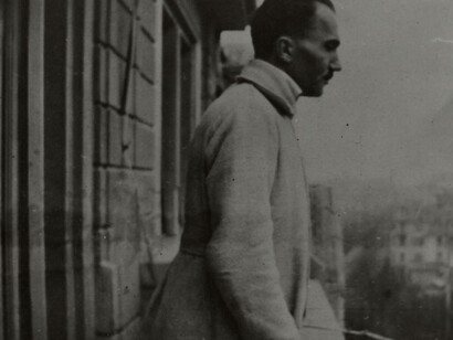 Nikos Kazantzakis in Zurich, Switzerland overlooking the city from his balcony