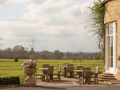 A serene view of Lucknam Park, nestled in the Wiltshire countryside, England