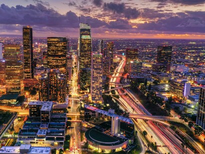 Downtown Los Angeles lit beneath a beautiful sunset, representing the city's ever-evolving creative energy