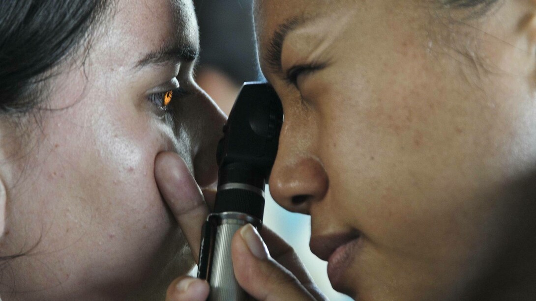 A doctor examining a patient thoroughly leaving no stone unturned