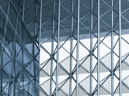 The striking close-up of these metal panels illustrates how their clean lines and reflective finishes contribute to the bold and forward-thinking design of the building, pushing architectural boundaries