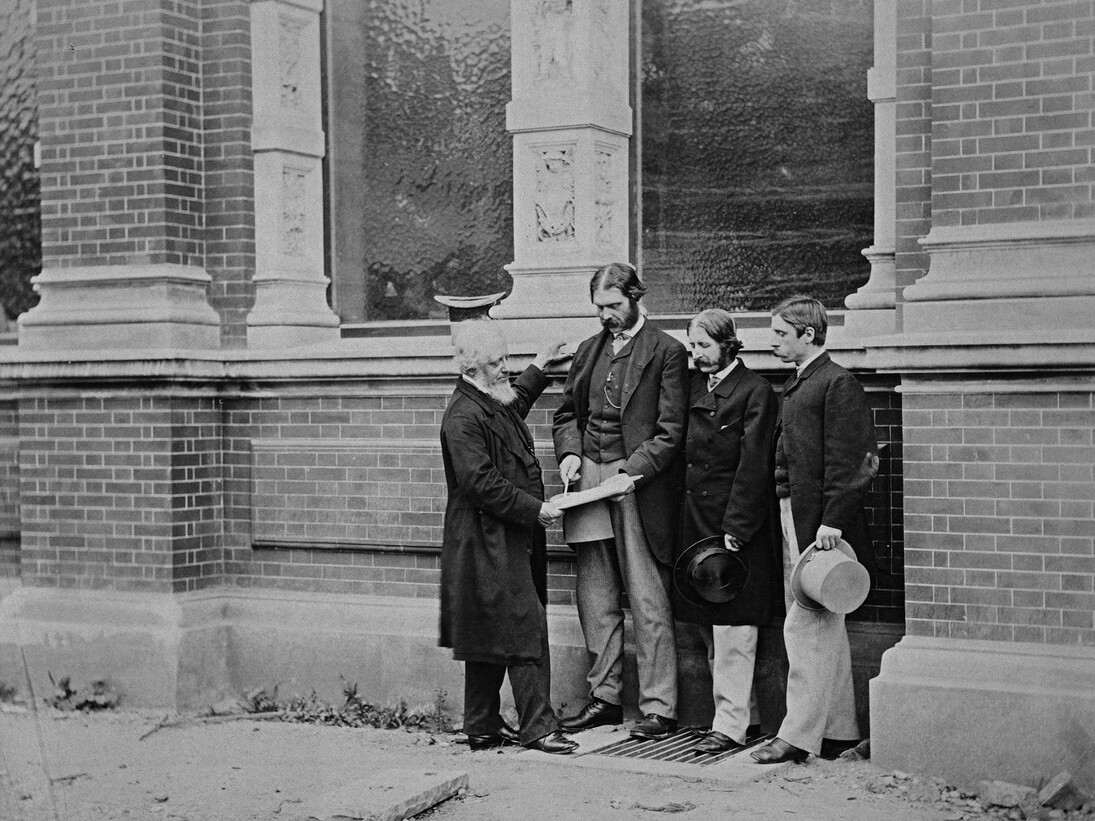 Henry Cole, Francis Fowke, Godfrey Sykes and John Liddell in front of the residences range, photograph possibly by Charles Thurston Thompson, about 1863. Museum no. E.1086-1989. © Victoria and Albert Museum, London