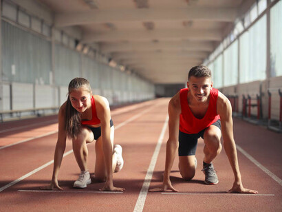 Poised and ready to sprint, these athletes embody the dedication required for success in the world of competitive sports and management