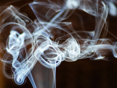 Smoke ascending and slowly dissolving into the air