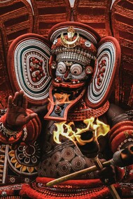 Theyyam, a vibrant Hindu ritual featuring red-and-white deities, is practiced in the North Malabar region of Kerala and parts of Karnataka