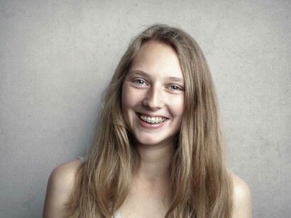 Young girl smiling with braces