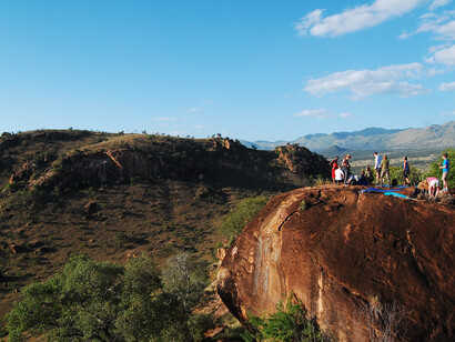 Yoga retreat goers from Modo Yoga on top of a look out hill at Campi ya Kanzi