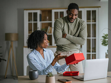 A woman’s disappointed reaction to a gift from a man, reflecting control disguised as care in the relationship