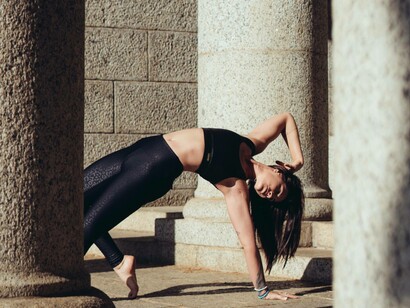 A woman performing yoga and communicating with her soul