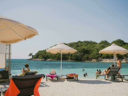 A relaxing beach day in Ksamil, Vlorë County, Albania, known for its turquoise waters and soft white sands