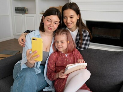 A loving same-sex couple spending precious moments with their daughter at home, highlighting the connection and joy in LGBTQ+ families